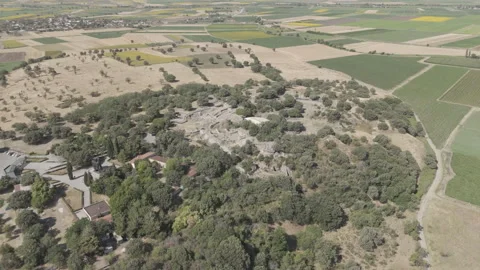 D-Log M. Tevfikiye, Turkey. Ancient ruins of Troy and stone walls surrounded by Stock Footage 318638350