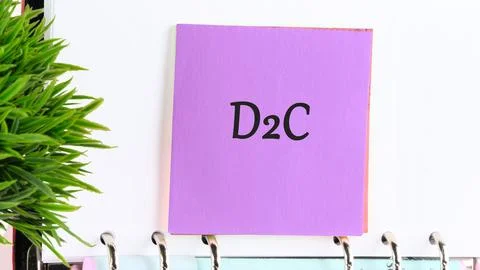 D2C direct to consumer symbol. Concept words D2C on a purple sticker on the.. Stock Photos