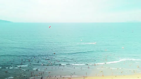 Da nang beach in vietnam buzzing with many people enjoying summer water sports Video stock 338206307
