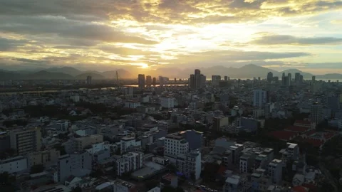 Da nang cityscape views during sunset, warm light casting over the urban Stock Footage 340548625
