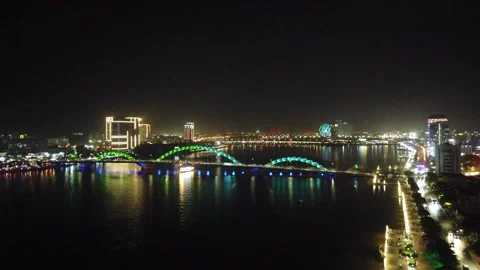 Da Nang Dragon Bridge at night with changing lights over river Stock Footage 335280356