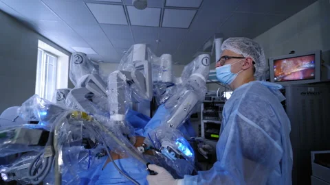 Da vinci surgical system. Doctor near the futuristic robotic equipment. Stock Footage 141983622