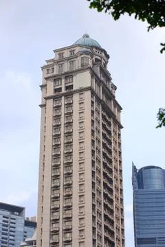 Da Vinci Tower Full View with Copper Dome Against Jakarta Modern Skyline Stock Photos