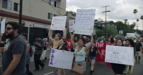 DACA supporters march from Echo Park Lake to Olvera in downtown Los Angeles, Stock Footage 81574587