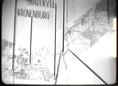 DACHAU - 1946: Malmedy trial — Pointer tip at KRONENBURG placard 库存影片 343543181