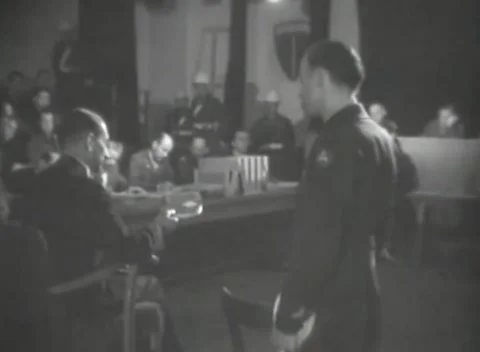DACHAU, GERMANY - 1947: Long table - Document rests before helmeted guard line 動画素材 344490793