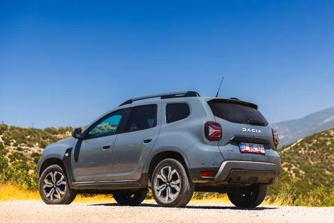 Dacia Duster close up rear side view. Modern gray off-road vehicle Stock Photos