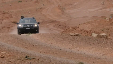 Dacia Duster runs in Morocco hinterlands near Dades, Africa in 4K Stock Footage 91862995