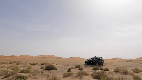 Dacia Duster trapped in Erg Cebbi desert, Morocco, Africa in 4K Stock Footage 92087375
