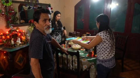 A dad and his daughters setting the table for Christmas dinner Stock Footage 146028029