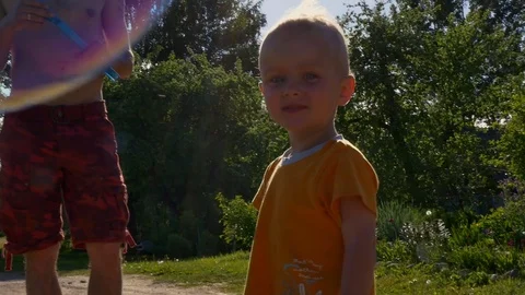 Dad and his son making bubbles at sunny day Stock-Footage 80085994