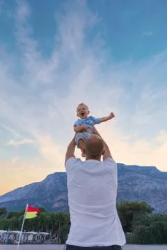 Dad and son having fun outdoors. Stock Photos
