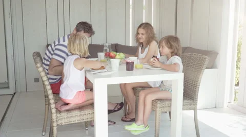 Dad and son hi five during breakfast Video stock 65172291