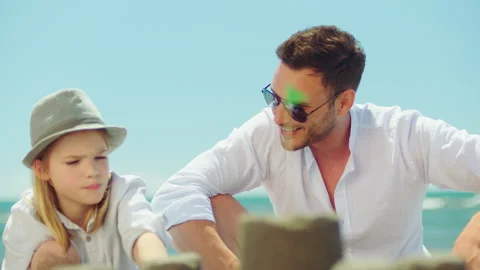 Dad and son playing on beach 스톡 동영상 155883233