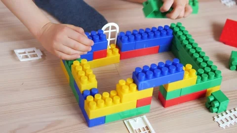 Dad and son playing in the constructor. Self-isolation concept for fighting Stock Footage 149573403