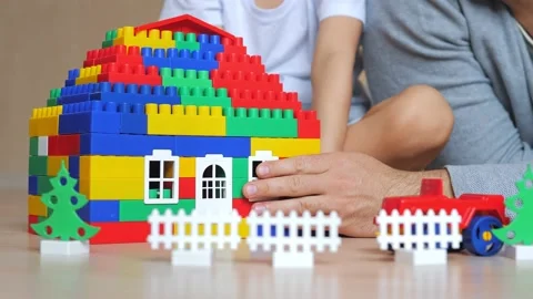 Dad and son playing in the constructor. Self-isolation concept for fighting Stock Footage 149585478