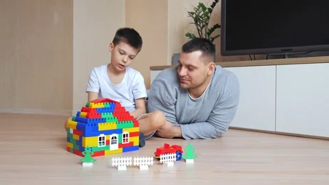Dad and son playing in the constructor. Self-isolation concept for fighting Stock Footage 149585958