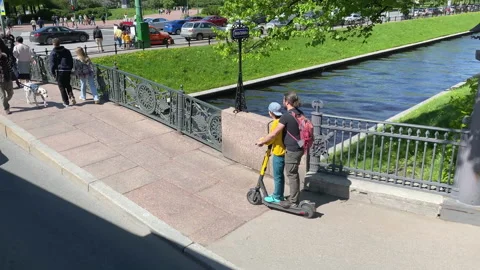 Dad and son ride the same electric scooter together Video stock 155426649