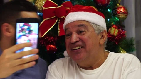 Dad and son taking selfie portrait with smartphone during Christmas Stock Footage 81377536