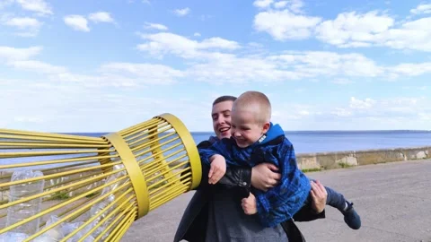 Dad and son throw the plastic bottle into the plastic collection container. Recy Video stock 153525663