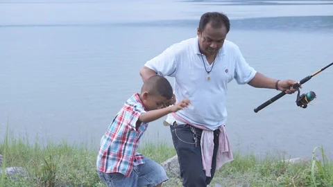 Dad and son walking on river Stock Footage 91878101