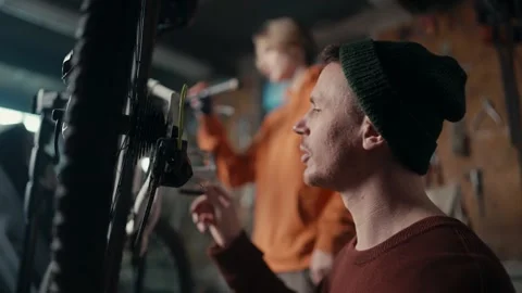 Dad and son work in the garage: dad teac... | Stock Video | Pond5