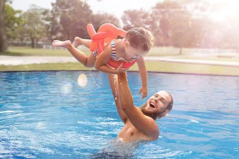 Dad with child in the pool Stock Photos