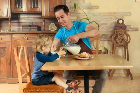 Dad cooks a breakfast Stock Photos