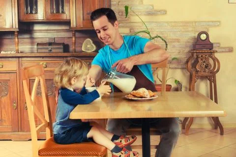 Dad cooks a breakfast Stock Photos