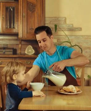 Dad cooks a breakfast Stock Photos