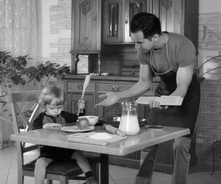 Dad cooks a breakfast Stock Photos