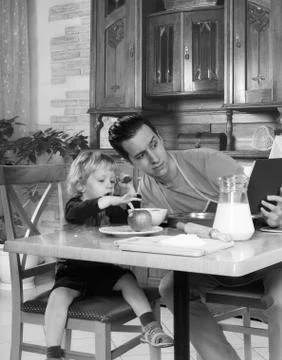 Dad cooks a breakfast Stock Photos