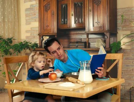 Dad cooks a breakfast Stock Photos