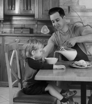 Dad cooks a breakfast Stock Photos