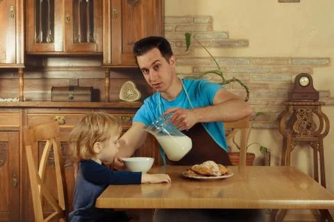 Dad cooks a breakfast Stock Photos