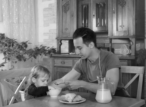 Dad cooks a breakfast Stock Photos