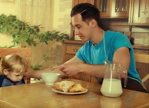Dad cooks a breakfast Stock Photos