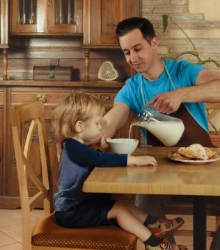 Dad cooks a breakfast Stock Photos