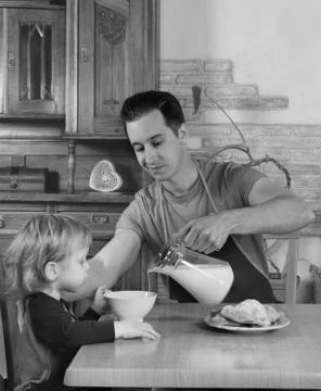 Dad cooks a breakfast Stock Photos