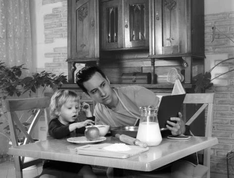 Dad cooks a breakfast Stock Photos