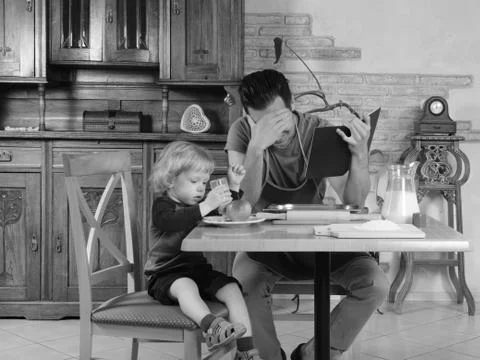 Dad cooks a breakfast Stock Photos