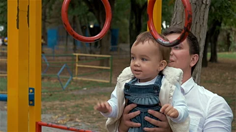 Dad with daughter on the Playground Video stock 57299558
