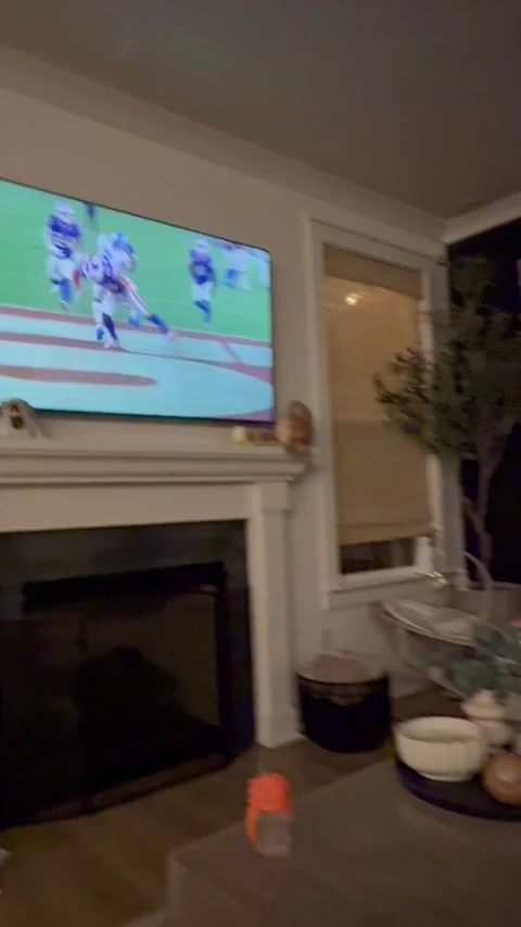 Dad Distractingly Feeds Baby While Watching Football, Spring Hill, Tennessee, US Stock Footage 346187532