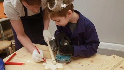 Dad Explains to his son how the grinder works Stock Footage 102241341
