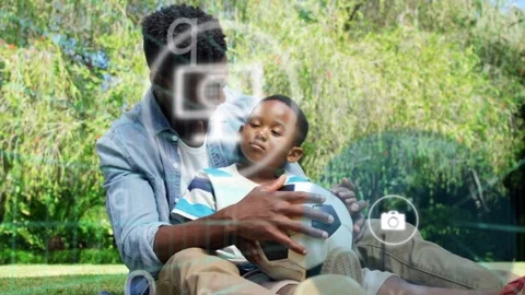 Dad guiding soccer ball, teaching child to test control while tech face box and Stock Footage 333154880