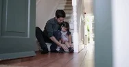 Dad Helping Daughter With Her Shoes Stock Footage