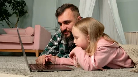 Dad helping kid with homework having fun looking at pc. online shopping Stock Footage 161836085