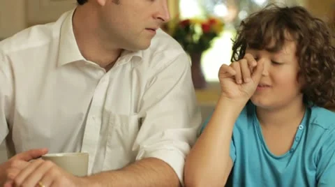 Dad helping son with homework Stock Footage 22664079