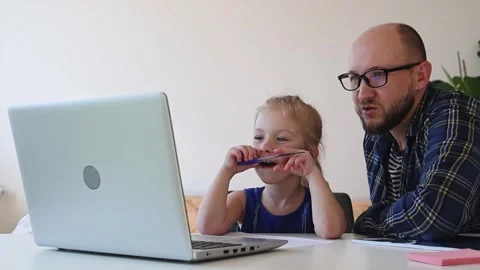 Dad helps daughter do homework from online school. Stock Footage 244008047