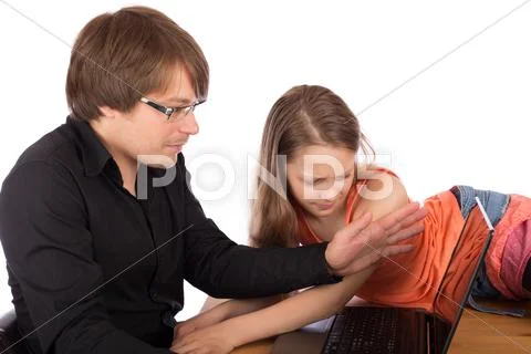 Dad hides laptop to his daughter Stock Photos